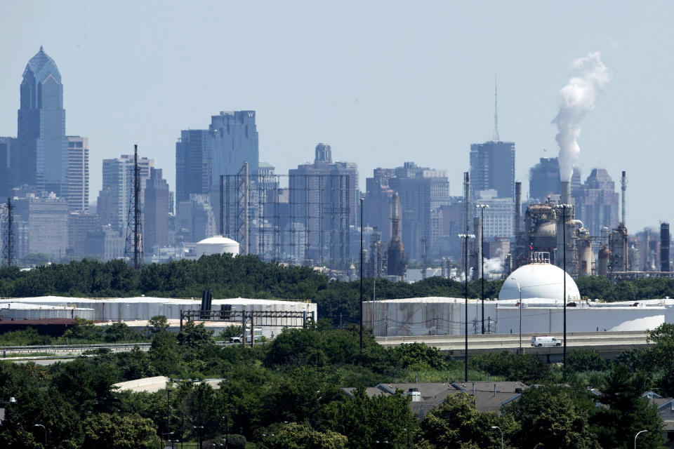 Smoke billows from the Philadelphia Energy Solutions Refining Complex in Philadelphia, Wednesday, June 26, 2019. The owner of the largest oil refinery complex on the East Coast is telling officials that it will close the facility after a fire last week set off explosions and damaged the facility. Philadelphia Mayor Jim Kenney said in a statement Wednesday that Philadelphia Energy Solutions had informed him of its decision to shut down the facility in the next month. The more than 1,000 workers there will be impacted, the mayor said. (AP Photo/Matt Rourke)