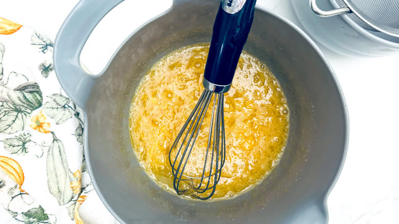 whisking eggs in bowl