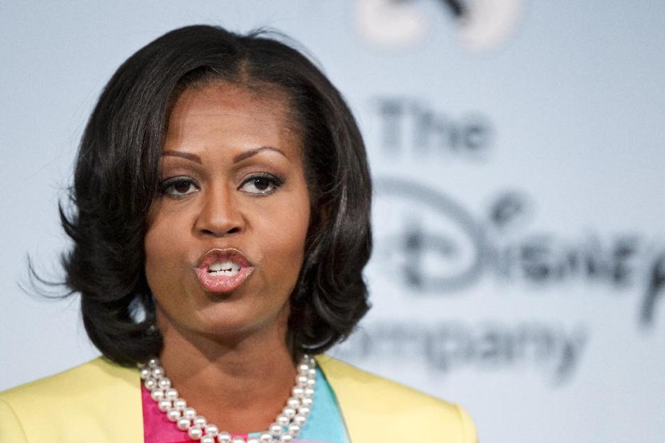 First lady Michelle Obama speaks at the Newseum in Washington, Tuesday, June 5, 2012, where she joined the Walt Disney Company to announce that Disney will become the first major media company to introduce new standards for food advertising on programming targeting kids and families. (AP Photo/Manuel Balce Ceneta)