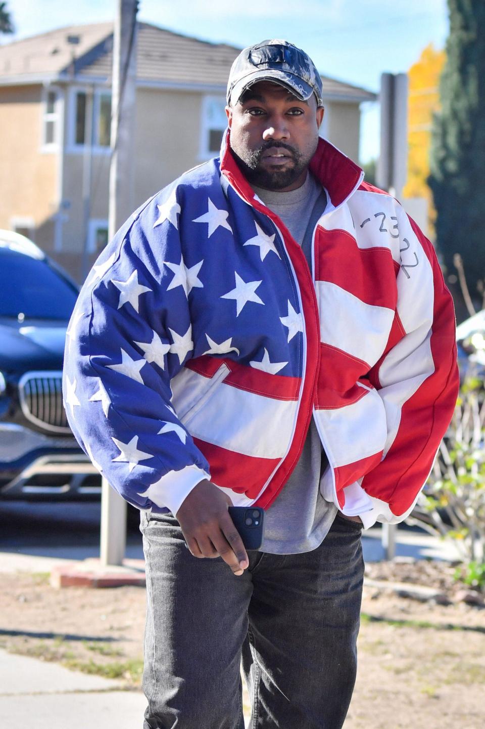 Kanye West heads church wearing an American flag jacket