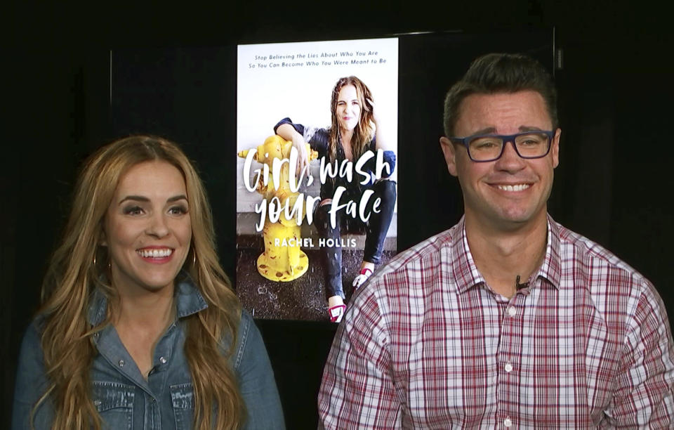 FILE - This image taken from video shows Rachel Hollis, left, author of "Girl, Wash Your Face: Stop Believing the Lies About Who You Are so You Can Become Who You Were Meant to Be," and her husband Dave Hollis, during an interview on Aug. 28, 2018, in New York. Dave Hollis, who left his spot as a Disney executive to join this then-wife Rachel in running her lifestyles empire, which include her bestselling book “Girl, Wash Your Face,” has died at his home in Texas on Sunday, Feb. 12, 2023. He was 47. (AP Photo, File)