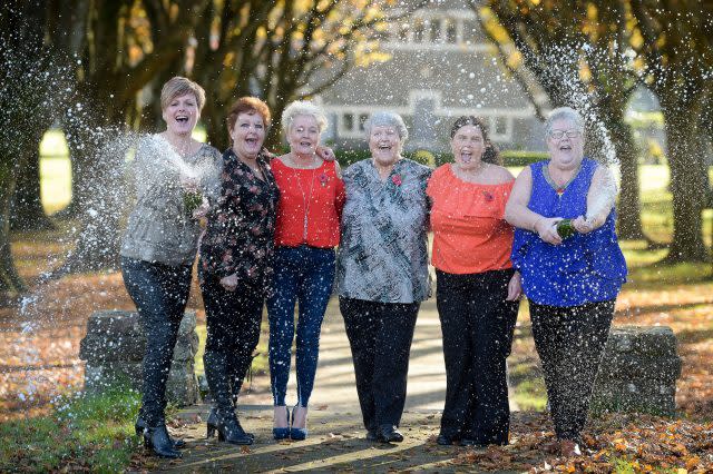 EuroMillions winners Julie Saunders, Doreen Thompson, Julie Amphlett, Jean Cairns, Louise Ward and Sian Jones celebrate during a photocall at Hensol Castle