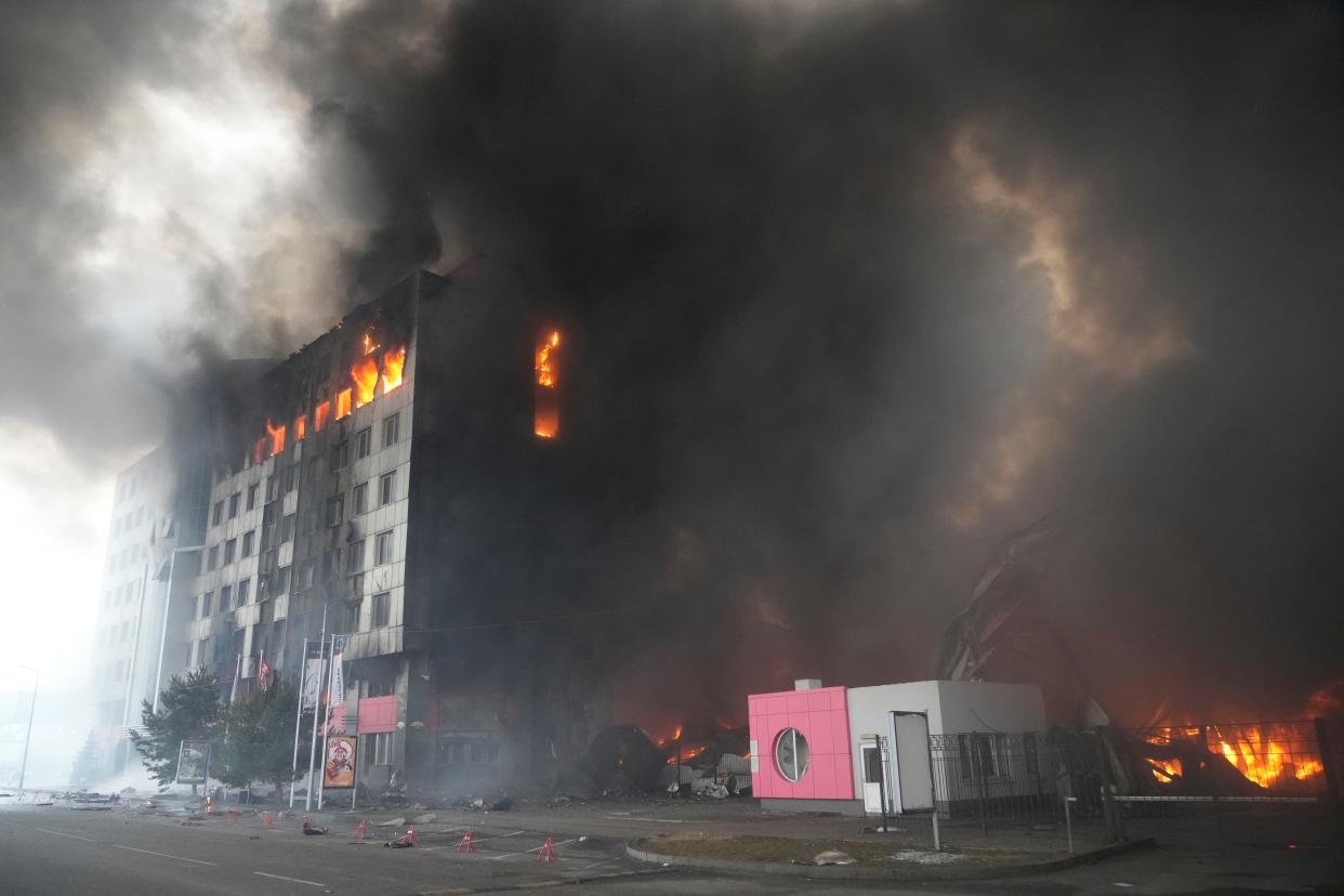 A building burns after shelling in Kyiv on Thursday. Russian forces have escalated their attacks on crowded cities in what Ukraine's leader called a blatant campaign of terror.