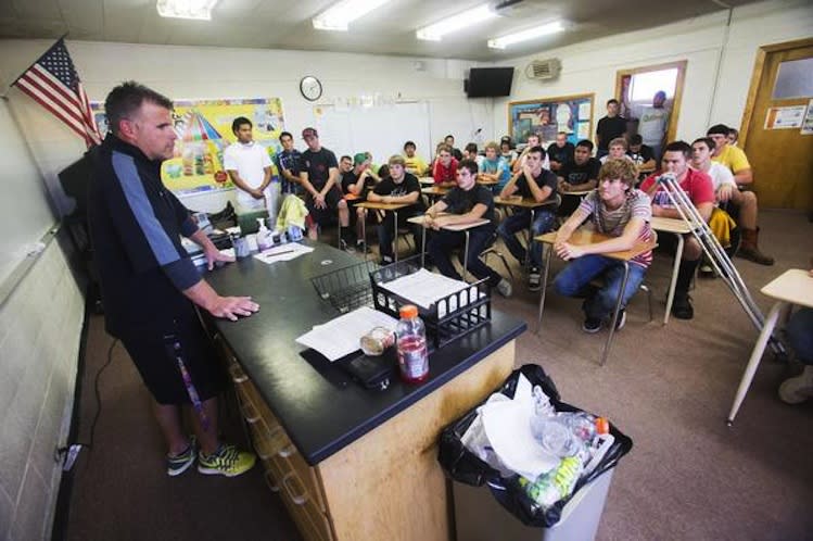 Union High football coach Matt Labrum speaks to his players after a community service outing — Deseret News