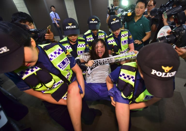 South Korean protestors clashed with police on Thursday as they tried to disrupt the opening in Seoul of a Tokyo-funded foundation for women forced to work in Japanese wartime brothels