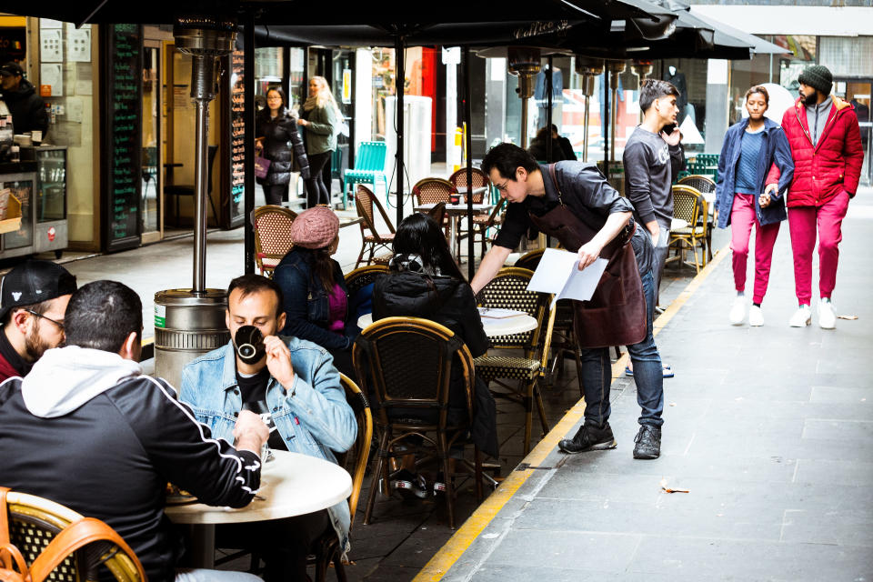 MELBOURNE, AUSTRALIA - JUNE 01: Cafes in Melbourne's Degraves street open for dine in customers on June 01, 2020 in Melbourne, Australia. Restrictions continue to ease around Australia in response to the country's declining COVID-19 infection rate. In New South Wales, beauty salons, tanning salons and nail bars can reopen from 1 June, along with museums, zoos and galleries while pubs, clubs, cafes and restaurants will also be able to serve up to 50 customers at a time. Traveling to regional NSW for a holiday will be allowed again. In Victoria, museums, zoos and galleries can reopen while restaurants, pubs and cafes can serve meals for up to 20 patrons. Beauty salons, spas and tattoo parlours can also open for up to 20 people. Gatherings of up 20 people in a home, overnight stays at private residences and tourist accommodations and greater numbers at weddings, funerals and religious ceremonies are also permitted as of 1 June 2020. Restrictions in South Australia also continue to ease from Monday June 1, with cinemas, theatres, galleries, museums, beauty salons, gyms and indoor fitness centres across the state able to reopen. Those venues, along with pubs, bars, restaurants and cafes, will be able to admit up to 80 patrons, provided they can contain them to groups of 20 or less. Any business opening to patrons must allow four square metres for every one person inside, and ensure 1.5-metre social distancing is observed. (Photo by Darrian Traynor/Getty Images)