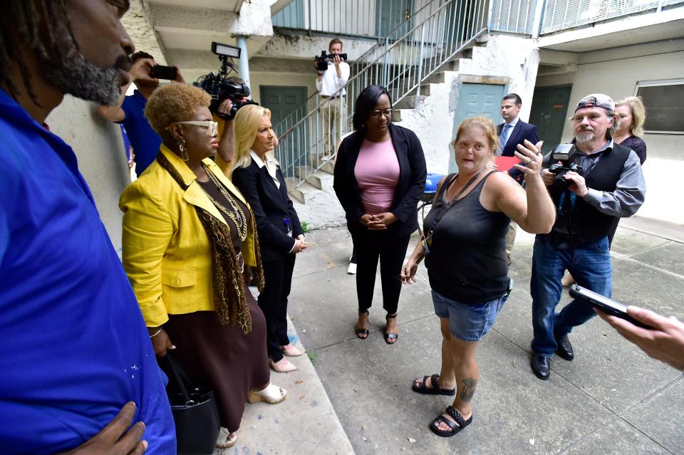 City Council Member Ju'Coby Pittman and Jacksonville Mayor Donna Deegan talk with Cascade Apartments resident April Sizemore during a tour of the complex Tuesday afternoon. Mayor Deegan, Council Member Pittman and representatives from the U.S, Department of Housing & Urban Development as well as code compliance personnel made a visit to the Cascade Apartments on Kings Park Drive after resident complaints about living conditions at the complex Tuesday, July 25, 2023. [Bob Self/Florida Times-Union]