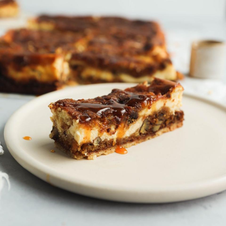 <p>Our carrot cake cheesecake bars are truly delicious. Layers of shortbread, carrot cake and cream cheese, finished with a drizzle of carrot caramel - which is easier than you think to make! </p><p>Get the <a href="https://www.delish.com/uk/cooking/recipes/a39435636/carrot-cake-cheesecake-bars/" rel="nofollow noopener" target="_blank" data-ylk="slk:Carrot Cake Cheesecake Bars;elm:context_link;itc:0;sec:content-canvas" class="link ">Carrot Cake Cheesecake Bars</a> recipe.</p>