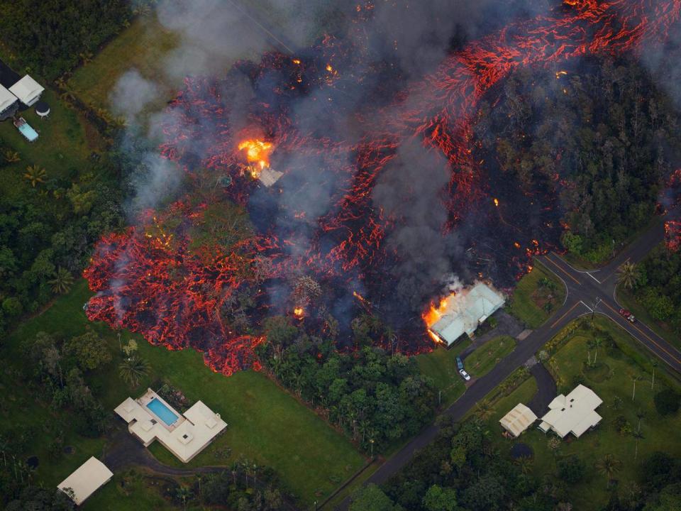 A massive flow of lava consumes houses in Leilani Estates (EPA/PARADISE HELICOPTERS)