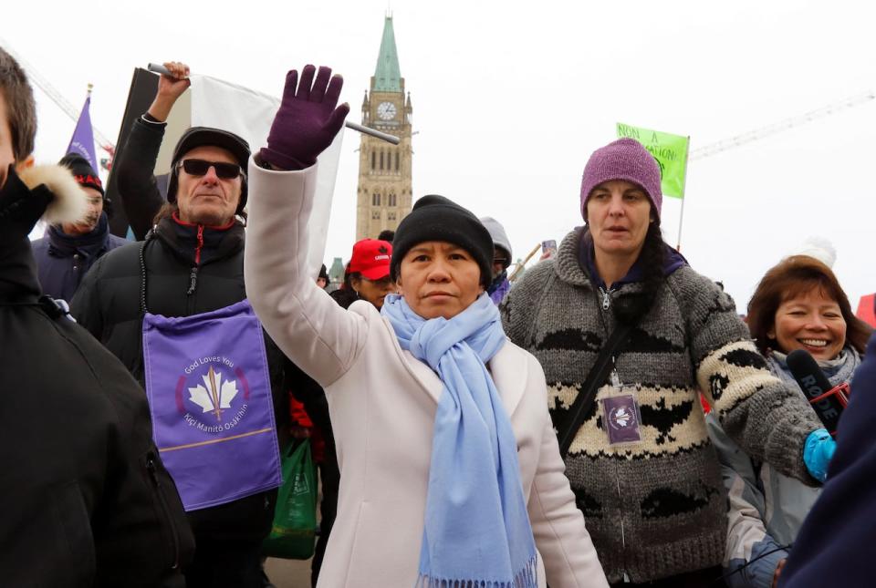 Romana Didulo, the self-declared "Queen of Canada" and a leading Canadian QAnon figure, leaves after speaking on Parliament Hill during convoy protests on February 3, 2022.  