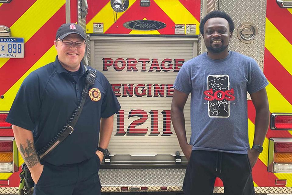 <p>Portage MI Dept of Public Safety - Police & Fire</p> Cedric Figures and a member of the Portage Fire Department