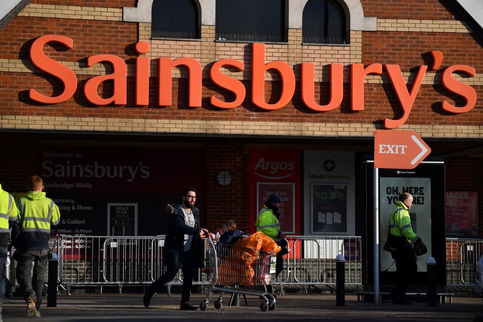 A shopper leaves a Sainsbury's supermarket in Tunbridge Wells on January 7, 2021. - Sainsburys has upgraded its profit expectations by £60m after surging sales of champagne, steaks and other luxury food drove stronger than expected sales over Christmas and new year. (Photo by Ben STANSALL / AFP) (Photo by BEN STANSALL/AFP via Getty Images)