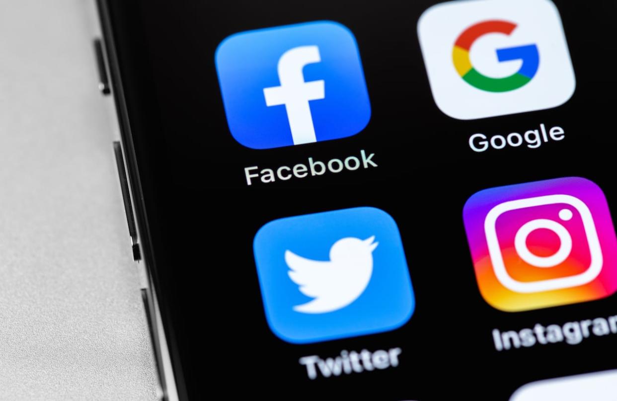 Facebook, Instagram, Google and Twitter app icons appear on an iPhone screen. (Shutterstock/Primakov - image credit)