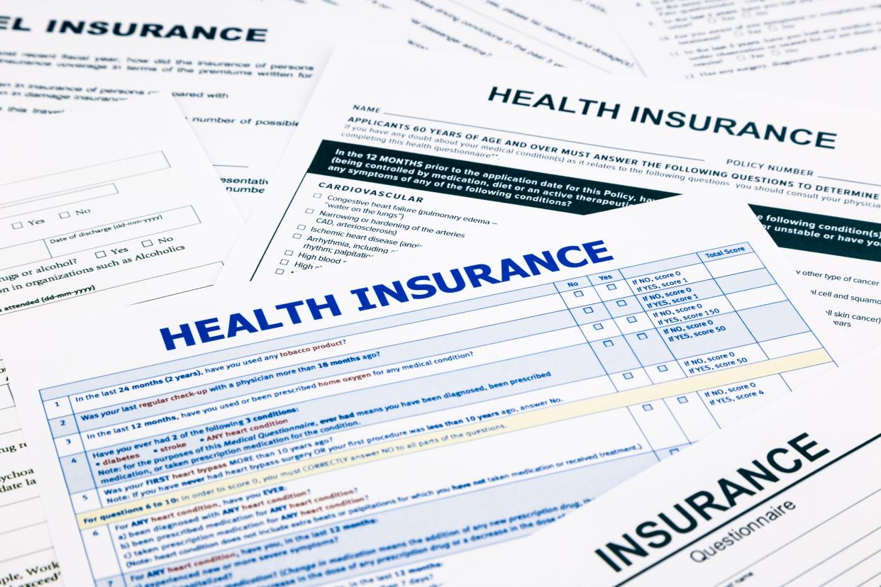 Health insurance form, paperwork and questionnaire for insurance concepts.