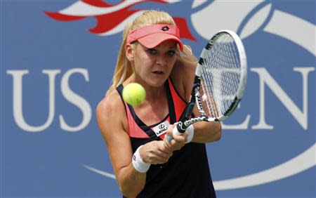 Agnieszka Radwanska of Poland hits a return to Anastasia Pavlyuchenkova of Russia at the U.S. Open tennis championships in New York August 30, 2013. REUTERS/Ray Stubblebine