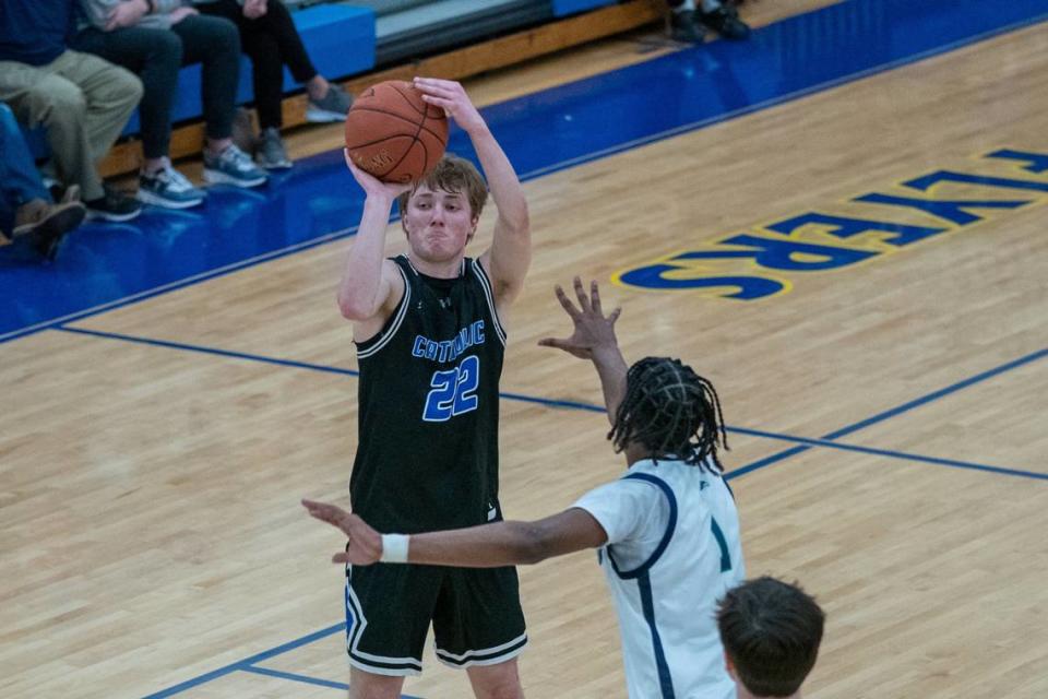 Lexington Catholic’s John Reinhart (22), shown against Great Crossing last season, made nine 3-pointers and scored 31 points against Fleming County on Sunday at the Kentucky 2A Championships finals in Owensboro.