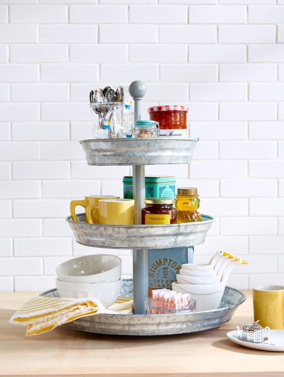 kitchen items stored in a three tier stand