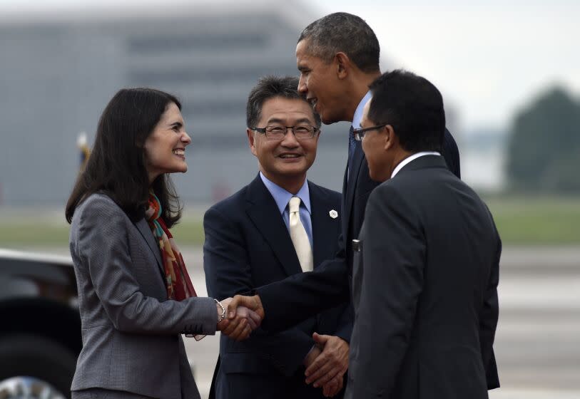 President Barack Obama shakes hands with Nina Hachigian, U.S. Ambassador to ASEAN, after arriving at Subang Airbase in Kuala Lumpur, Malaysia, Friday, Nov. 20, 2015. Obama is traveling to Malaysia where he will join leaders from Southeast Asia to discuss trade and economic issues, and terrorism and disputes over the South China Sea. (AP Photo/Susan Walsh)