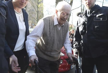 Defendant Oskar Groening arrives for his trial in Lueneburg April 21, 2015. REUTERS/Fabian Bimmer