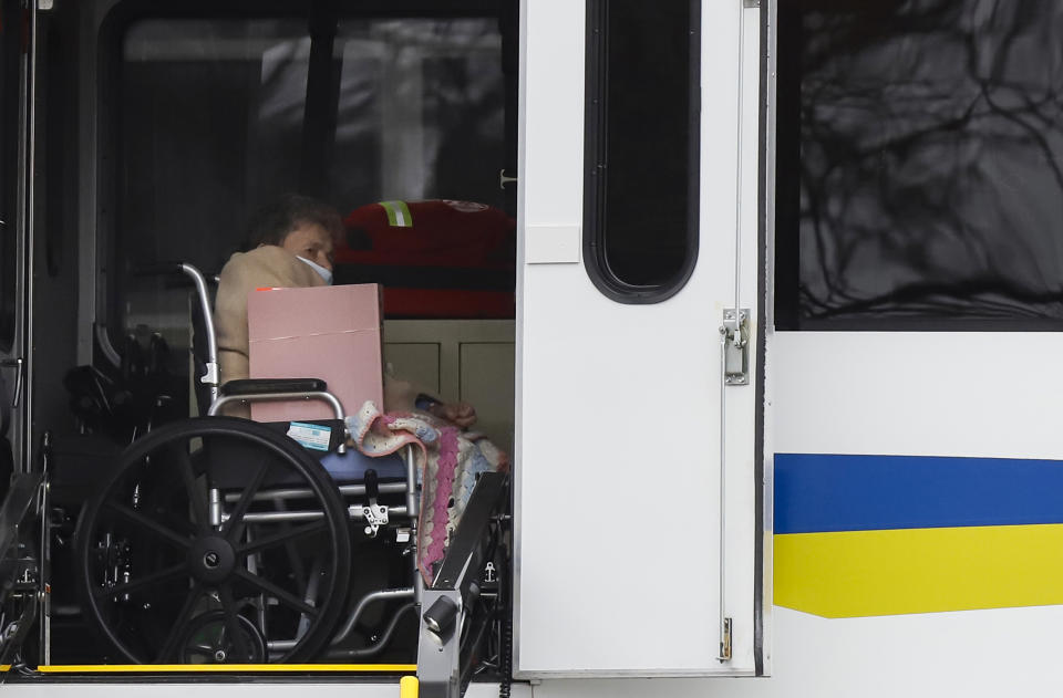 A resident from St. Joseph's nursing home is seen on board a bus while being evacuated by medical officials, after a number of residents tested positive for coronavirus disease (COVID-19) in Woodbridge, New Jersey