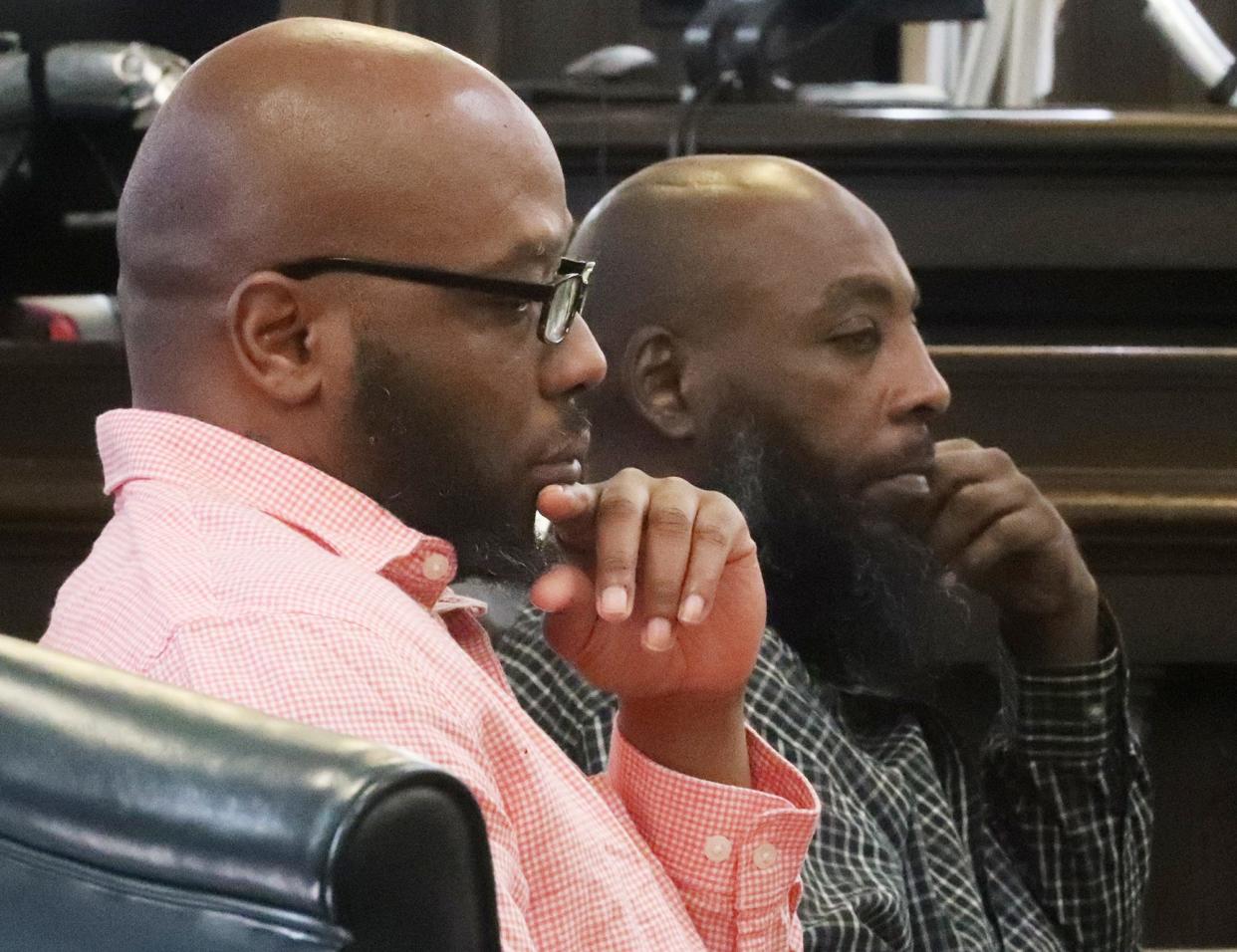 Defendants Alexander Quarterman and Anthony Fowler wait during a sidebar at their murder trial for the shooting death of Derrick Patterson on the first day of their trial in Summit County Common Pleas Judge Kathryn Michael's courtroom in Akron.