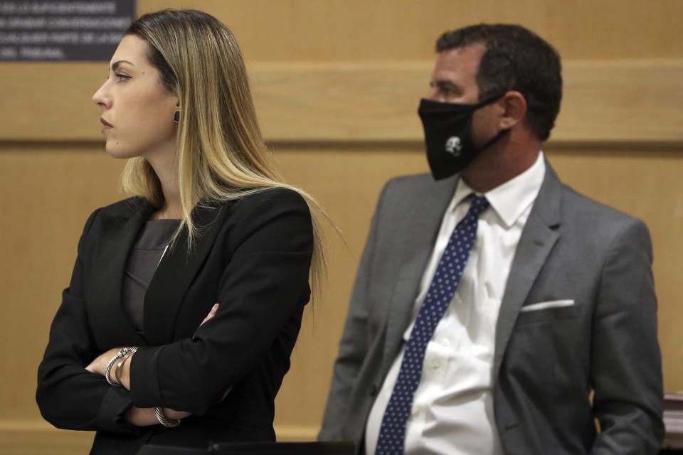 Assistant Public Defender Jaclyn Broudy and defense attorney Gabe Ermine listen during a pre-trial hearing for Parkland school shooter Nikolas Cruz at the Broward County Courthouse in Fort Lauderdale, Fla., Wednesday, July 14, 2021, on four criminal counts stemming from his alleged attack on a Broward jail guard in November 2018. Cruz is accused of punching Sgt. Ray Beltran, wrestling him to the ground and taking his stun gun. (Amy Beth Bennett/South Florida Sun-Sentinel via AP, Pool)