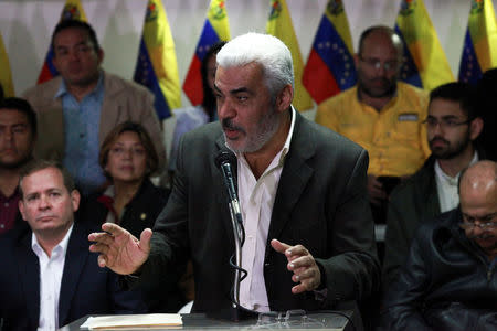 Angel Oropeza, member of the Venezuelan coalition of opposition parties (MUD), talks to the media during a news conference in Caracas, Venezuela February 21, 2018. REUTERS/Adriana Loureiro