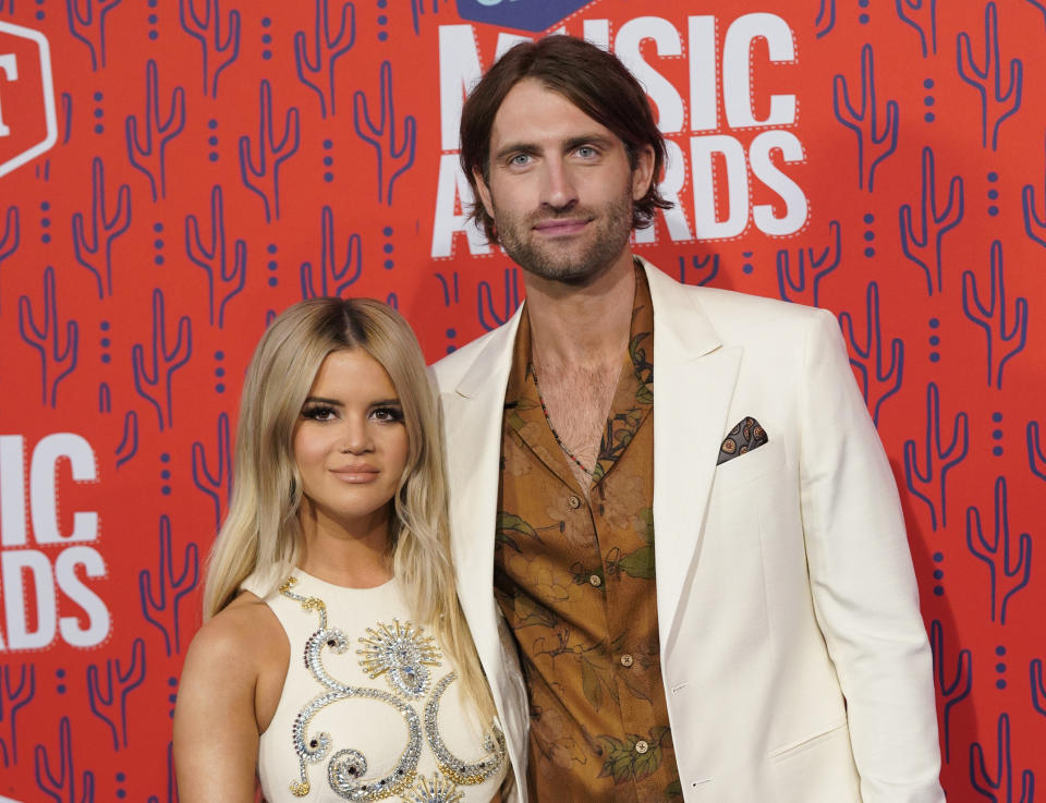 FILE - This June 5, 2019 file photo shows Maren Morris and Ryan Hurd at the CMT Music Awards in Nashville, Tenn. The Grammy-winning country singer posted of a photo of herself with her husband Hurd on Instagram on Tuesday announcing her pregnancy, saying “the universe would give us a baby boy to even things out.” (AP Photo/Sanford Myers, File)