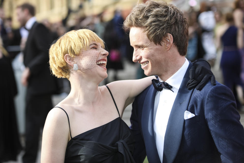 Jessie Buckley, left, and Eddie Redmayne pose for photographers upon arrival at the Olivier Awards in London, Sunday, April 10, 2022. (Photo by Vianney Le Caer/Invision/AP)