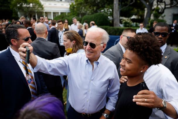 PHOTO: President Joe Biden poses for selfies during the Congressional Picnic on the South Lawn of the White House on July 12, 2022 in Washington, DC. (Chip Somodevilla/Getty Images)