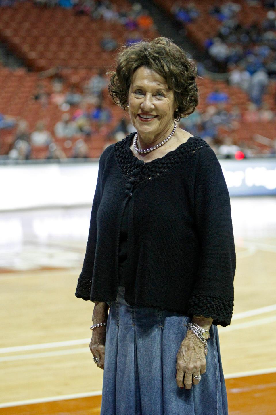 Grandbury Texas High School girl's basketball coach, Leta Andrews, attends the girls' UIL state basketball playoffs as she retires after 52 seasons with a national record 1416 career victories , Friday, Feb. 28, 2014, in Austin, Texas. (AP Photo/Michael Thomas)