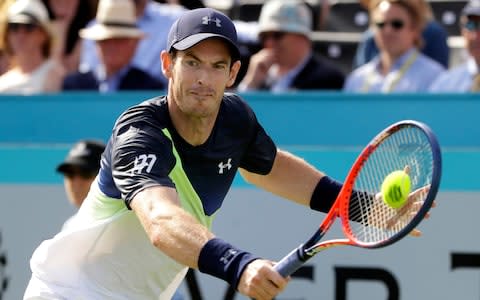 Andy Murray of Britain plays a return to Nick Kyrgios of Australia during their singles tennis match at the Queen's Club tennis tournament in London, Tuesday, June 19, 2018 - Credit: AP