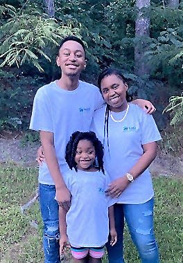 Ebony Pace, owner of Gadsden-Etowah Habitat for Humanity's 58th house, is pictured with her children, Patrick and Haley.