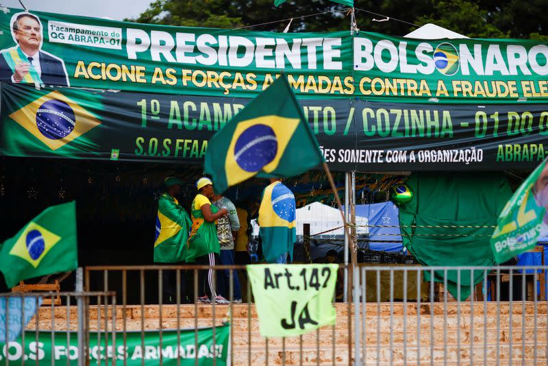 Supporters of of Brazil's President Jair Bolsonaro are seen at a camp during a protest against President-elect Luiz Inacio Lula da Silva at the Army Headquarters in Brasilia