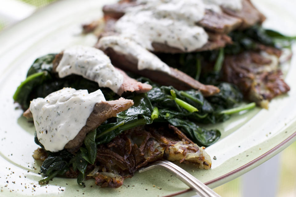 In this image taken on May 20, 2013, a Father's Day steakhouse dinner is shown served on a platter in Concord, N.H. (AP Photo/Matthew Mead)