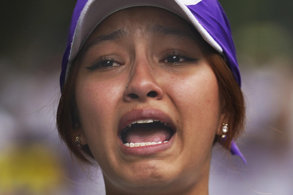 Vania Hernandez Portillo, whose mother is disappeared, joins mothers of disappeared children in a march to demand government help in the search for their missing loved ones, on Mother's Day in Mexico City, Wednesday, May 10, 2023. (AP Photo/Marco Ugarte)