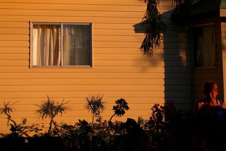 Local resident Judy Baldry waters her garden at her home in the outback town of Stonehenge, in Queensland, Australia, August 13, 2017. REUTERS/David Gray