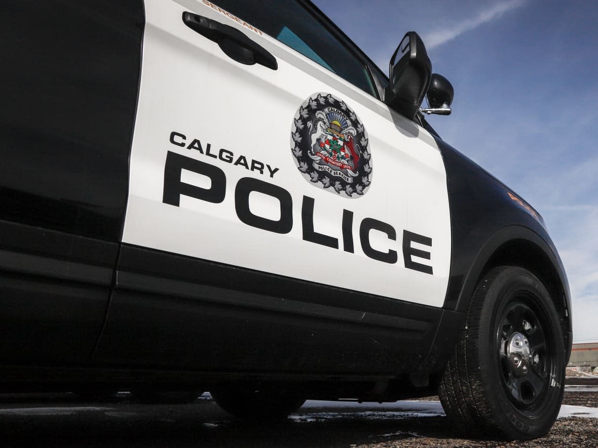 Police vehicles at Calgary Police Service headquarters in Calgary on Thursday, April 9, 2020.  (Jeff McIntosh/The Canadian Press - image credit)