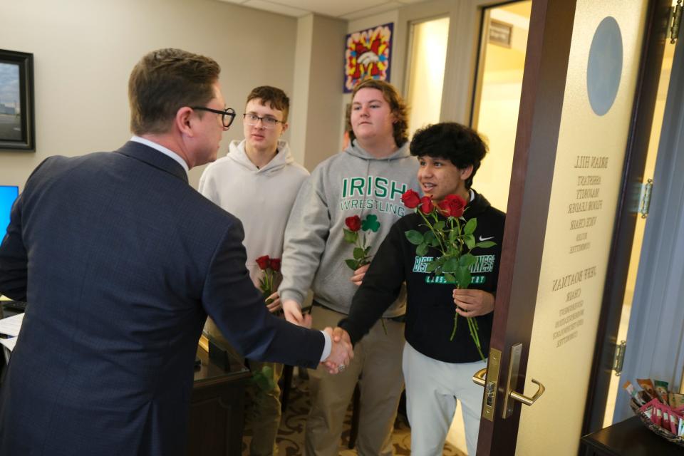 State Rep. Brian Hill, left, shakes hands with Bishop McGuinness students, from right, Dino Medicinebird-Busby, Baylor Moates and Luke Worthington as part of the annual Rose Day anti-abortion rally at the Oklahoma Capitol last month.