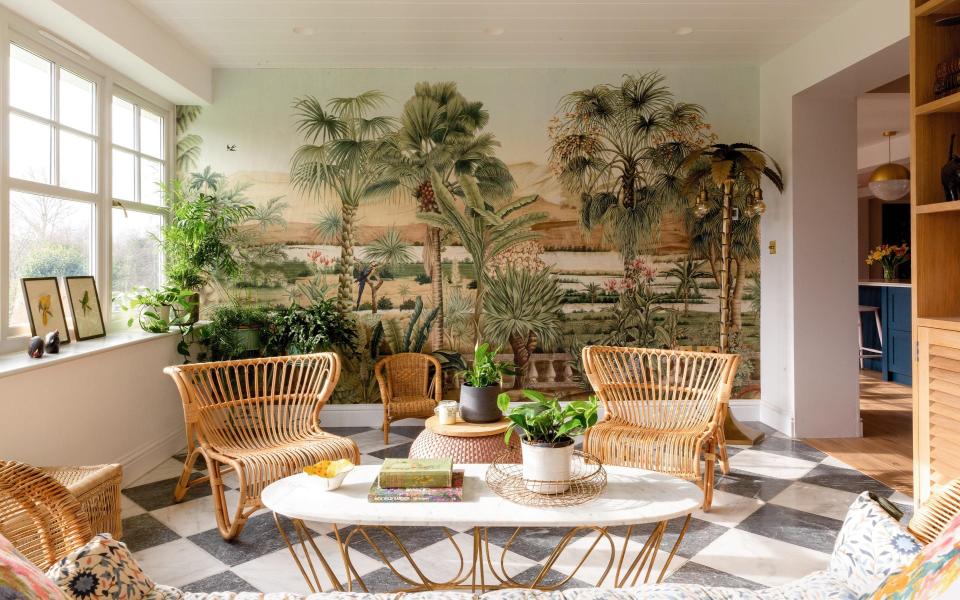 The wallpaper mural by Iksel is well matched by a palm-tree floor lamp from Rockett St George; the black and white floor tiles are from Mandarin Stone, the chairs and sofa are from Att Pynta, and the table is from Graham & Green - Emma Lewis