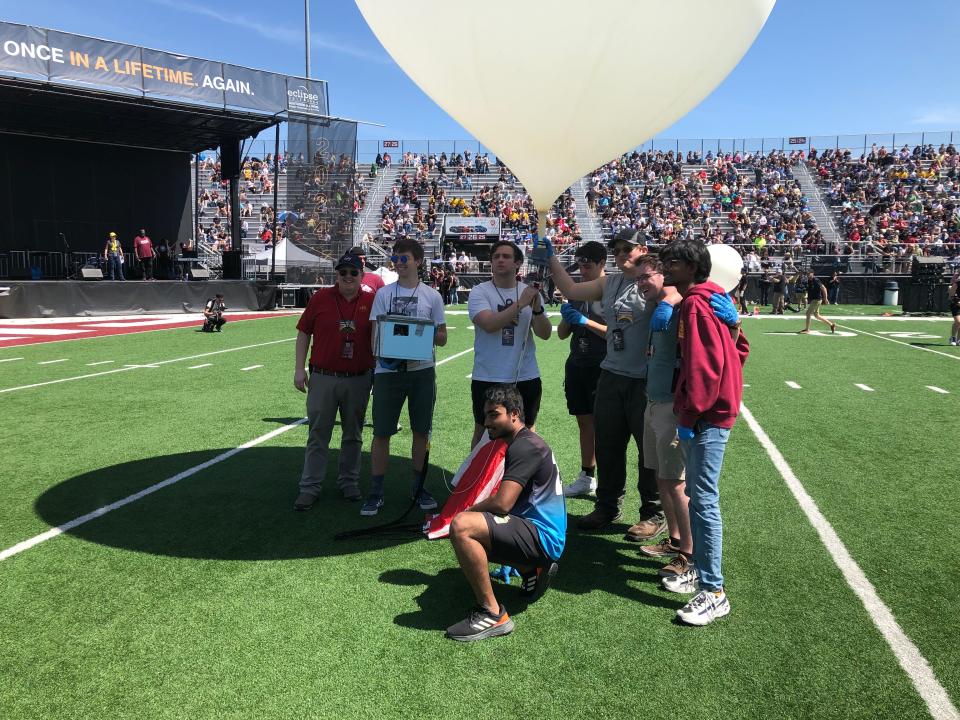 Iowa State University students and staff release a high-altitude balloon Monday, April 8, 2024, in Carbondale, Illinois, to watch the total solar eclipse.