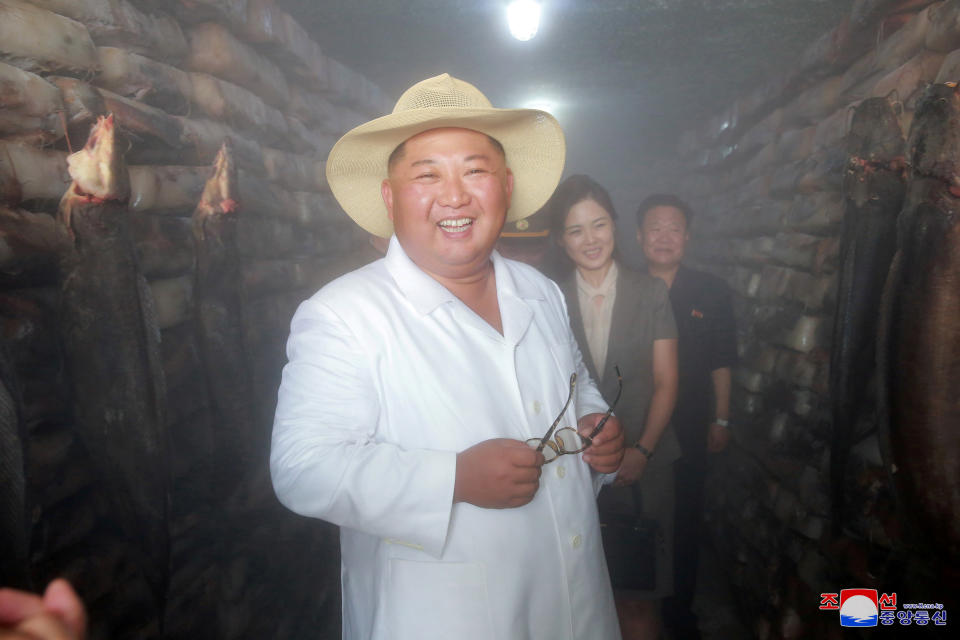 North Korean leader Kim Jong Un smiles as he provides field guidance at a catfish plant in this undated photo released by North Korea's Korean Central News Agency (KCNA) on August 5, 2018. KCNA via REUTERS    ATTENTION EDITORS - THIS IMAGE WAS PROVIDED BY A THIRD PARTY. REUTERS IS UNABLE TO INDEPENDENTLY VERIFY THIS IMAGE. NO THIRD PARTY SALES. SOUTH KOREA OUT. NO COMMERCIAL OR EDITORIAL SALES IN SOUTH KOREA.      TPX IMAGES OF THE DAY