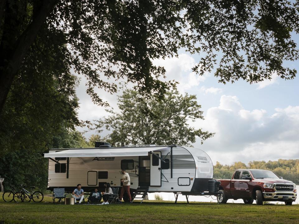 Winnebago's new Access RV outside next to a truck
