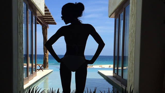 <strong>Naya Rivera</strong> is looking hotter than ever while flaunting her baby bump! Less than two months after announcing her pregnancy, the former <em>Glee </em>star and her husband <strong> Ryan Dorsey</strong> are enjoying a vacation in "paradise" before their little bundle arrives in the world. On Saturday, the 28-year-old actress shared an Instagram pic of her wading in the water wearing an itty-bitty tan bikini with the simple caption: "baby moon." <strong> WATCH: Glee's Heather Morris is 'Excited' Naya Rivera is Pregnant! </strong> If Rivera's Instagram photos are any indication, the happy couple is definitely having a wonderful time together on their Hawaiian vacay. Rivera and Dorsey were spotted walking hand-in-hand while the brunette beauty showed off her tan and pregnant belly in a black bikini and a printed cover-up. After taking in the gorgeous sunset views, Rivera and her hubby spent their Sunday morning "with some couples meditation on the beach then a walk around paradise." Consider us jealous!