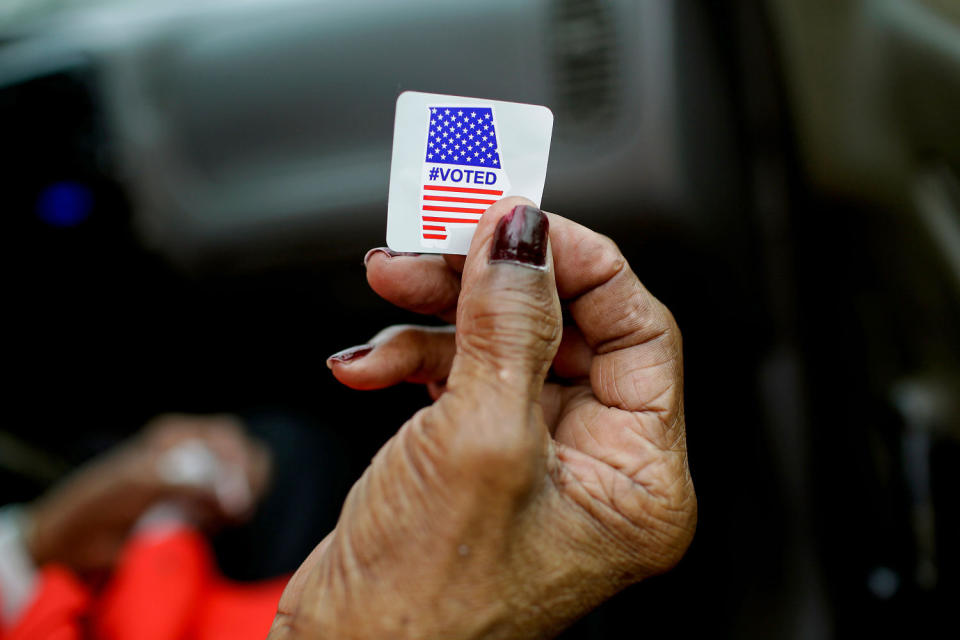 Sadie Janes shows off her voting sticker after casting her ballot during the Democratic presidential primary in Montgomery, Ala., on March 3, 2020. (Joshua Lott / AFP via Getty Images)