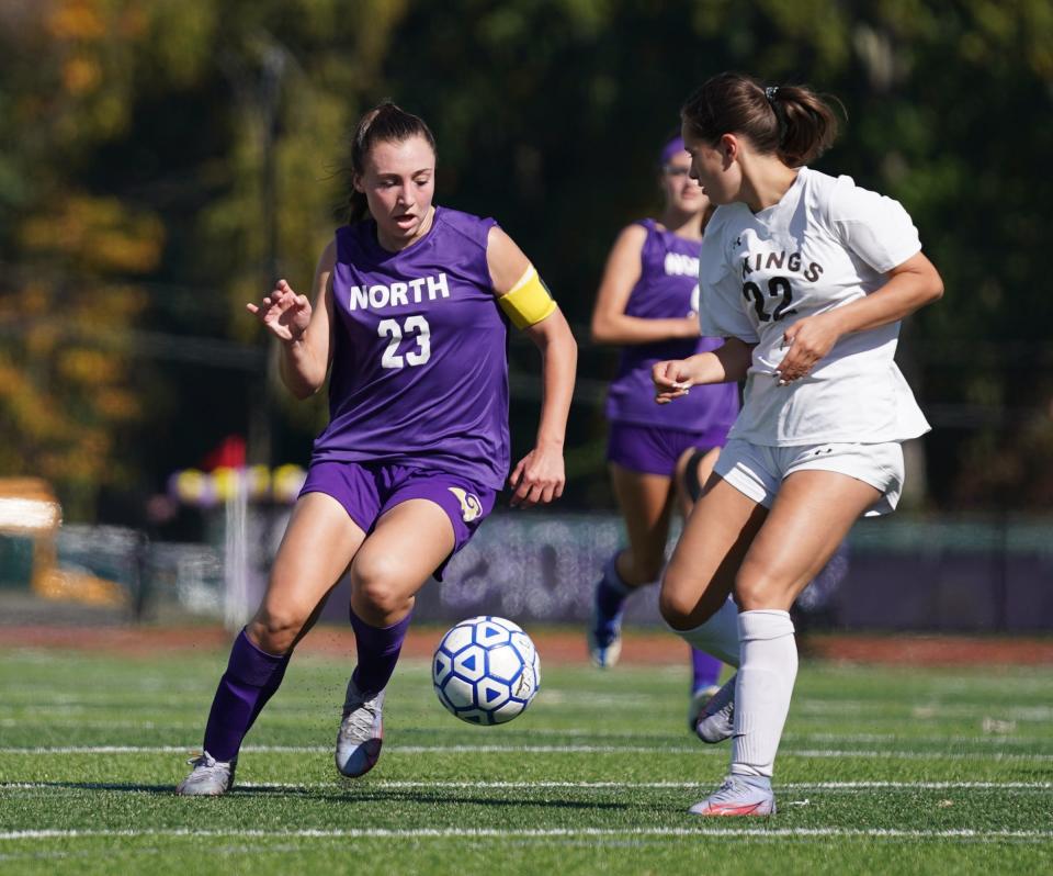 Clarkstown North's Alexa Buxbaum (23) works the ball as Clarkstown South's Julia Cerniglia (22) defends during their 3-1 win over Clarkstown South in girls soccer action at Clarkstown North School in New City on Saturday, October 15, 2022.