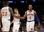 Mar 5, 2016; New York, NY, USA; New York Knicks forward Derrick Williams (23), guard Arron Afflalo (4) and guard Jose Calderon (3) celebrate against the Detroit Pistons during the second half at Madison Square Garden. The Knicks defeated the Pistons 102-89. Mandatory Credit: Adam Hunger-USA TODAY Sports / Reuters Picture Supplied by Action Images