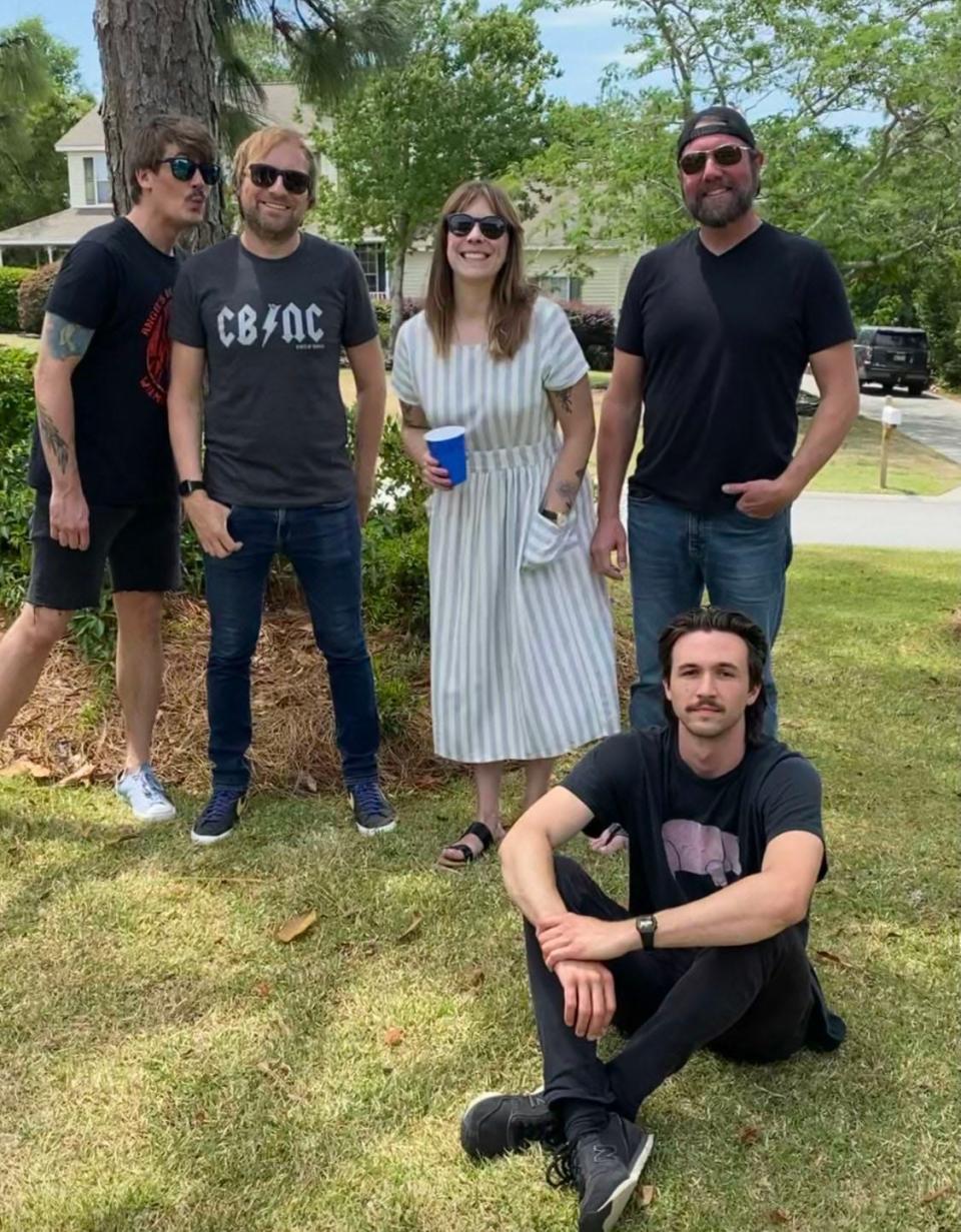 From left, Shaun Paul, Robin Cooksley, Shaylah Paul, Tom Micahels (sitting) and Greg Blair of Wilmington rock and pop band Kicking Bird.