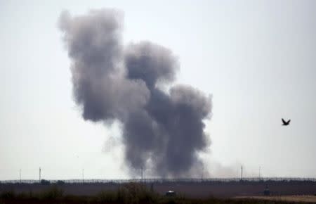 Smoke rises in Egypt's North Sinai along the border with southern Israel, July 1, 2015. REUTERS/Amir Cohen