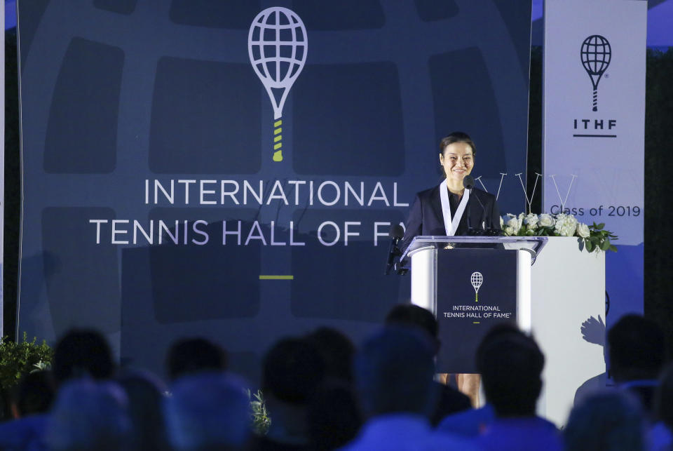 Tennis Hall of Fame inductee Li Na, of China, speaks to the crowd during ceremonies at the International Tennis Hall of Fame, Saturday, July 20, 2019, in Newport, R.I. (AP Photo/Stew Milne))